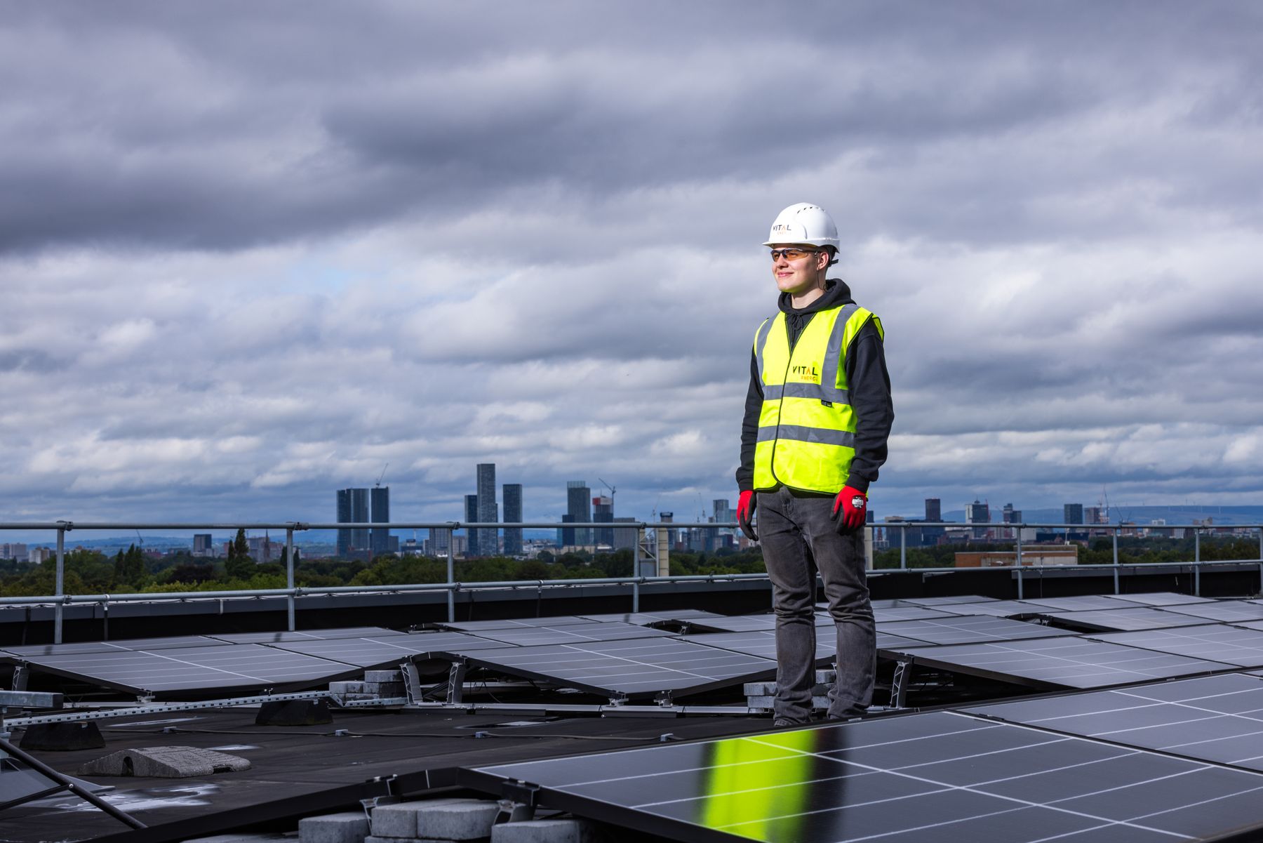 An engineer inspecting rooftop solar panels